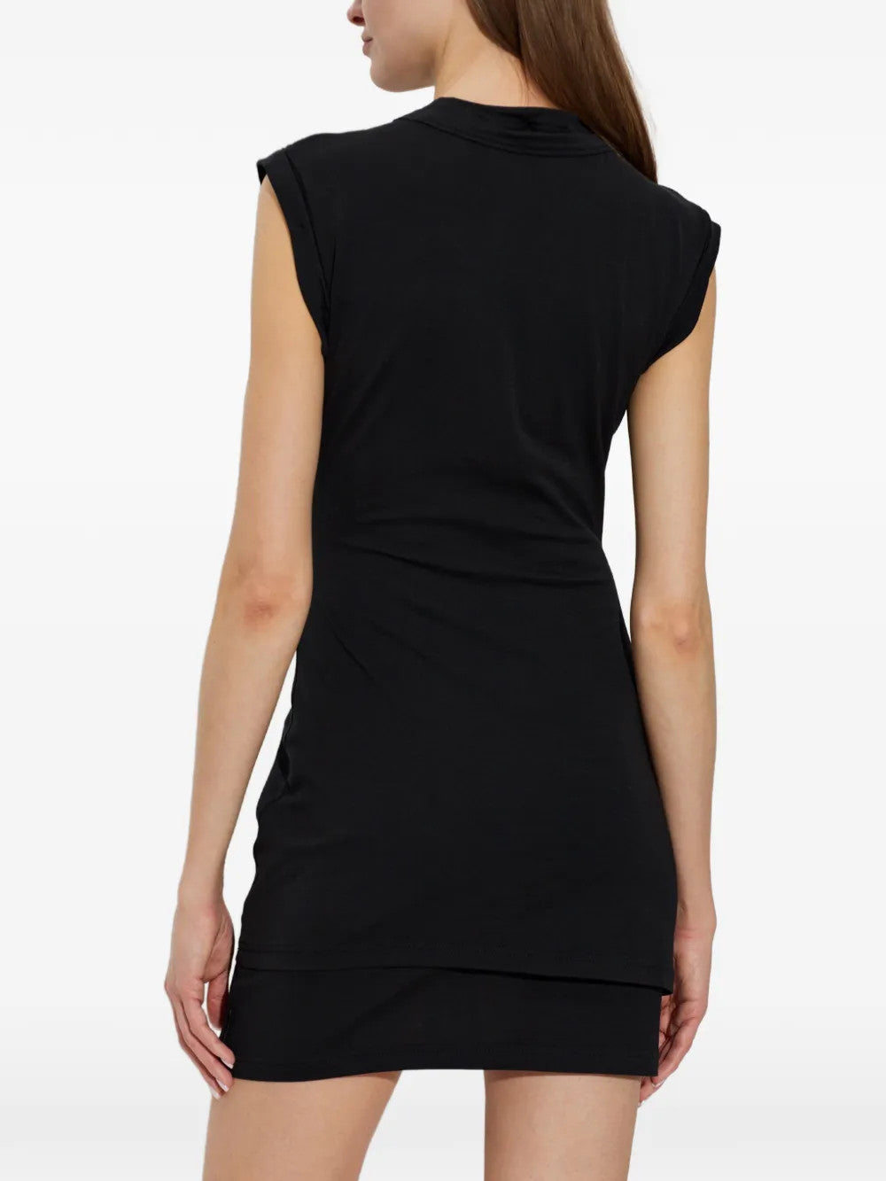 Black dress worn by a person, showing the dress fit
