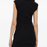 Black dress worn by a person, showing the dress fit