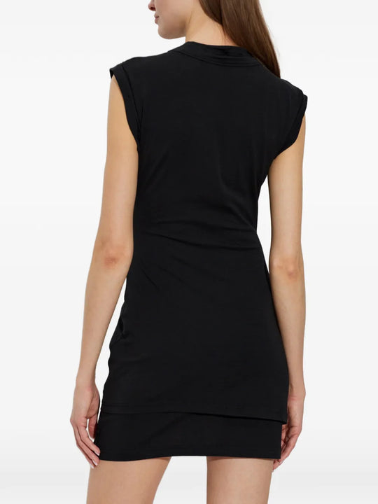 Black dress worn by a person, showing the dress fit