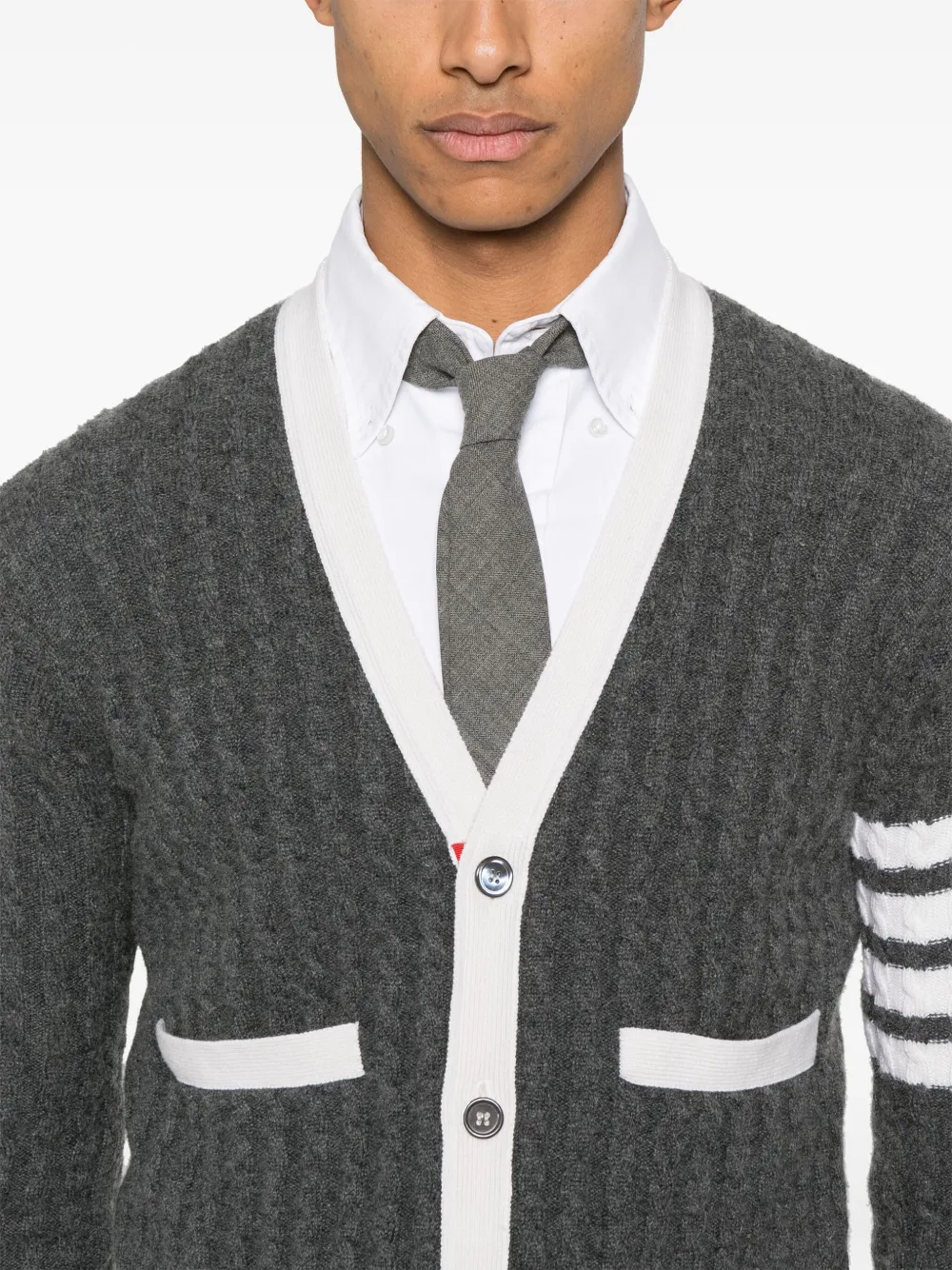 Close up of grey knitwear, showing texture of the cashmere fabric