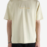 Tan t-shirt worn by a person, showing the t-shirt's view