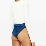 White top worn by a person, showing the top fit