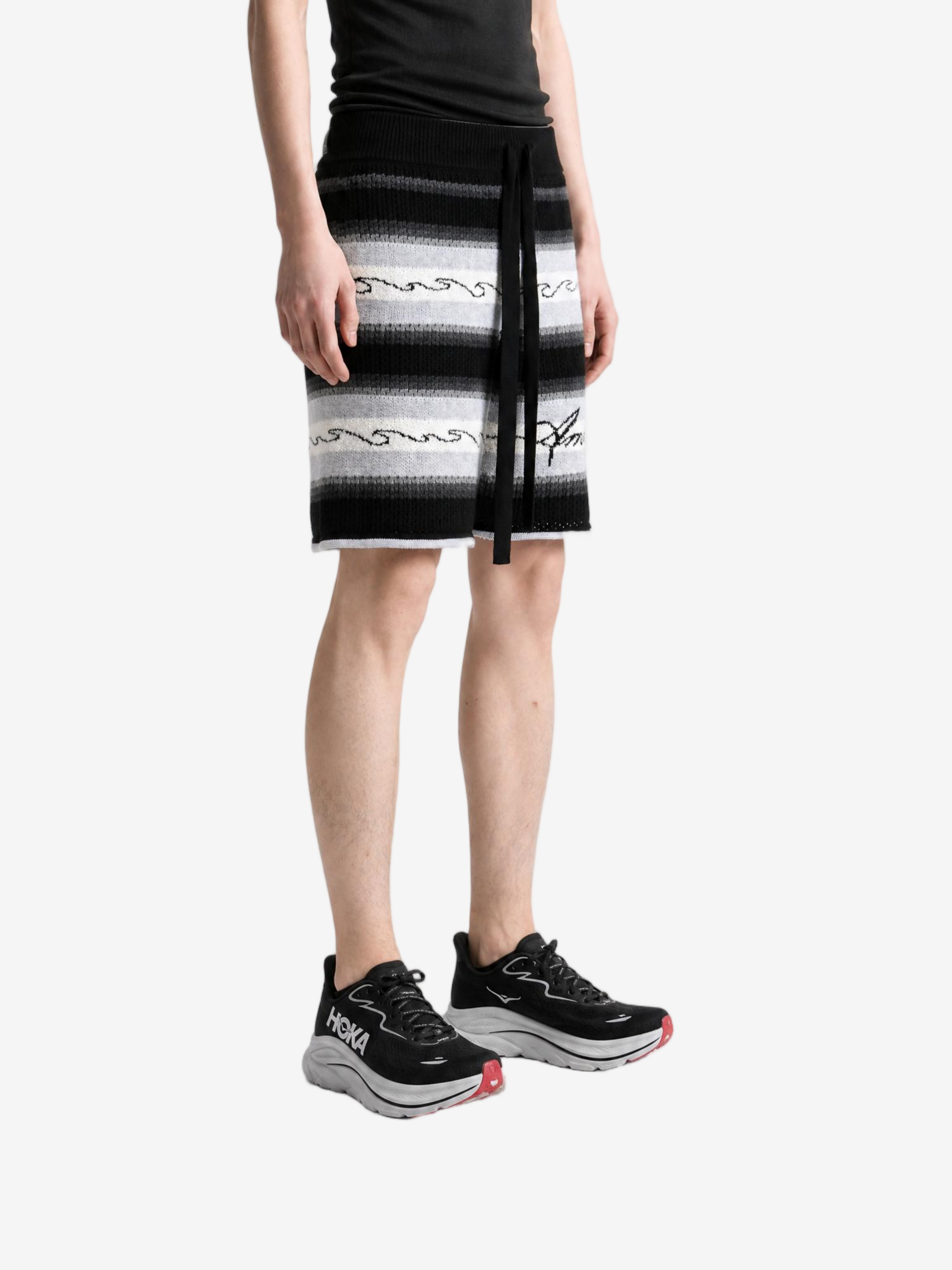 Black shorts worn by a person, showing the shorts fit