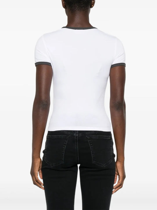 White t-shirt worn by a person, showing the shirt's fit
