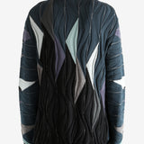 Black top worn by a person, showing the top's fit