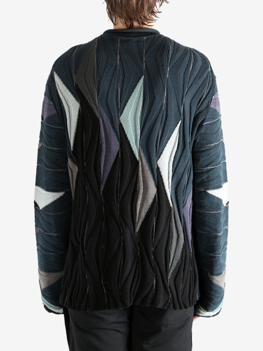 Black top worn by a person, showing the top's fit