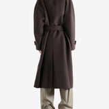 Brown coat worn by a person, showing the coat's fit