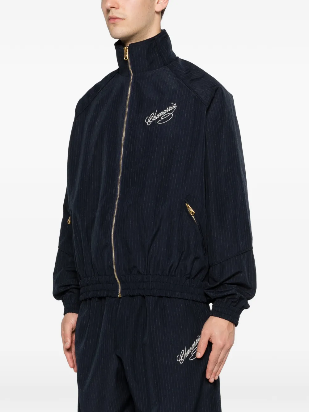 Blue jacket worn by a person, showing the jacket's fit
