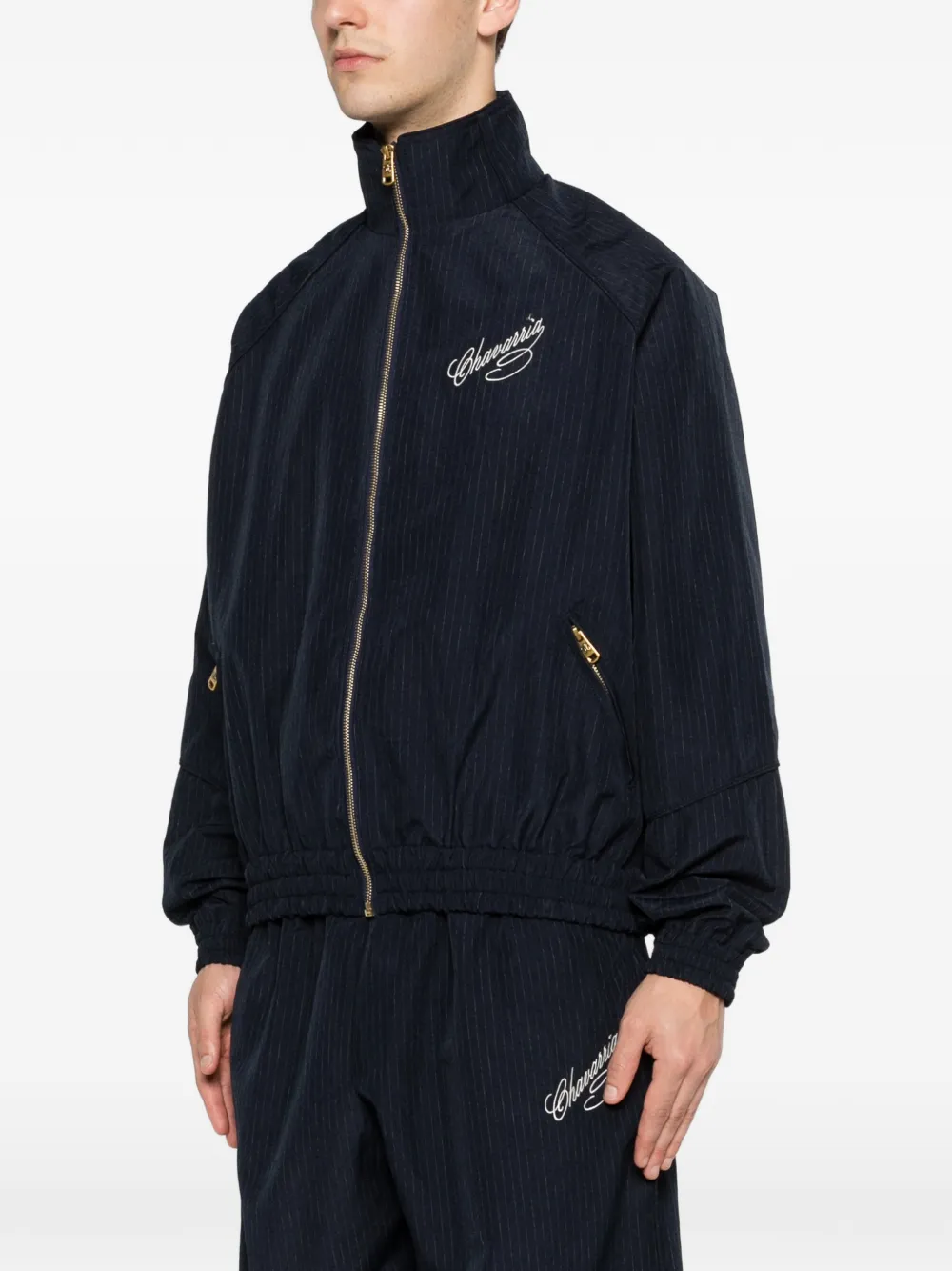 Blue jacket worn by a person, showing the jacket's fit