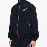Blue jacket worn by a person, showing the jacket's fit