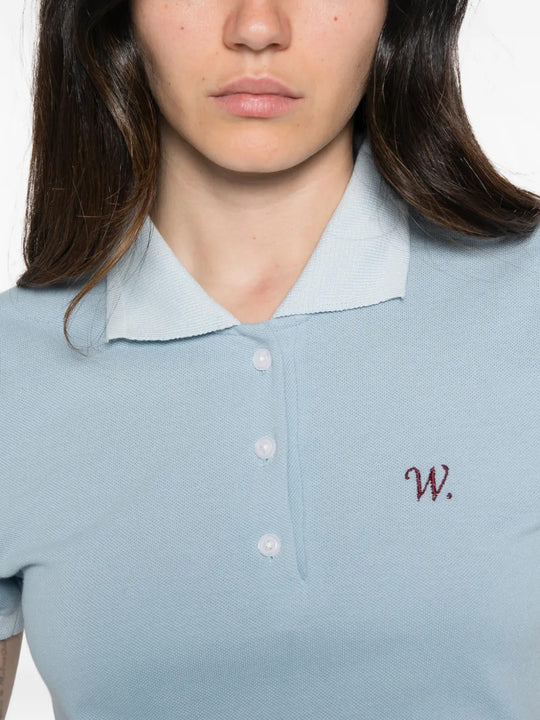 Blue top worn by a person, showing the top fit
