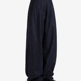 Navy pants worn by a person, showing the pants fit