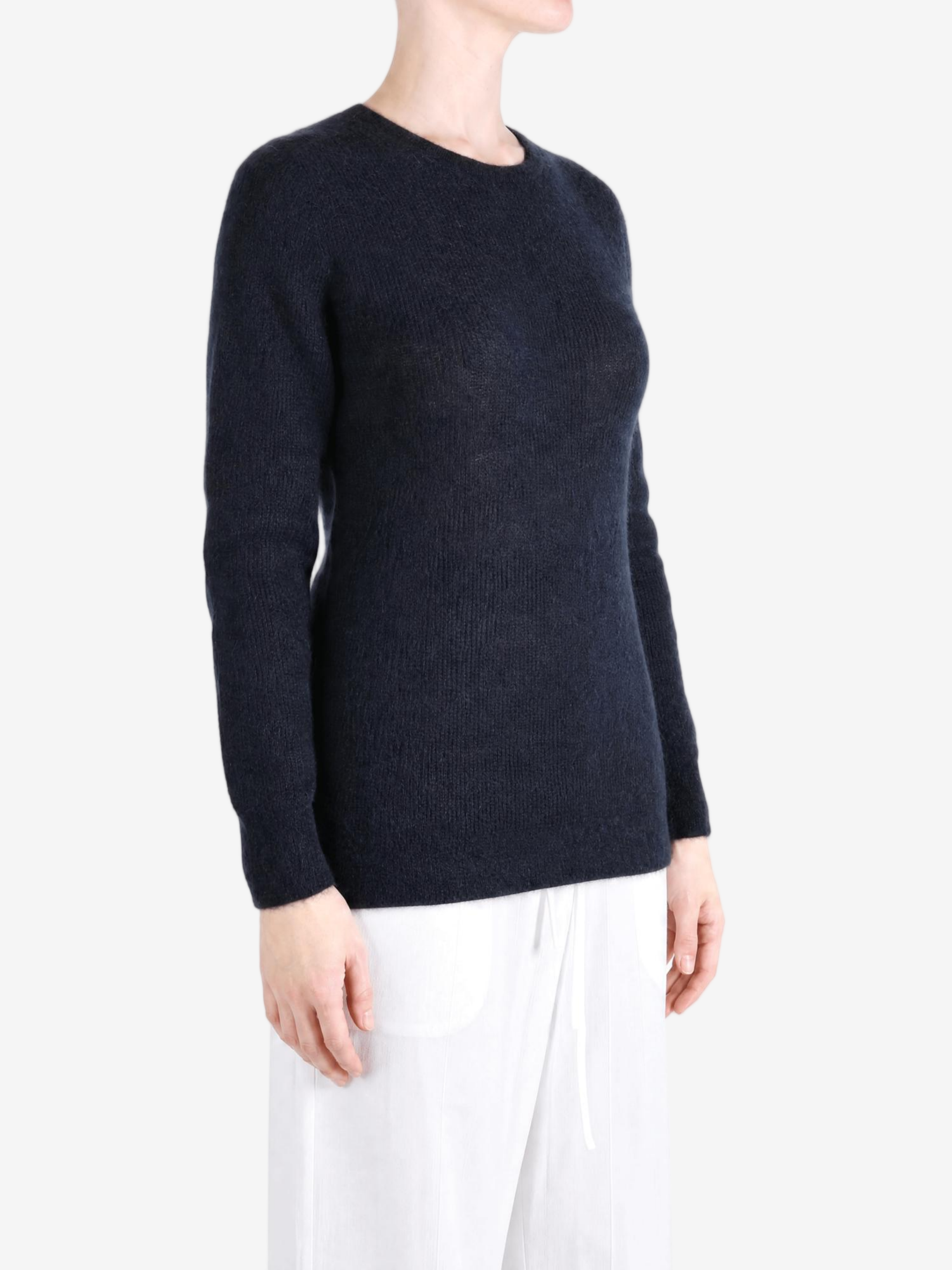 Navy knitwear worn by a person, showing the knitwear fit