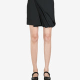 Black skirt worn by a person, showing the skirt's fit