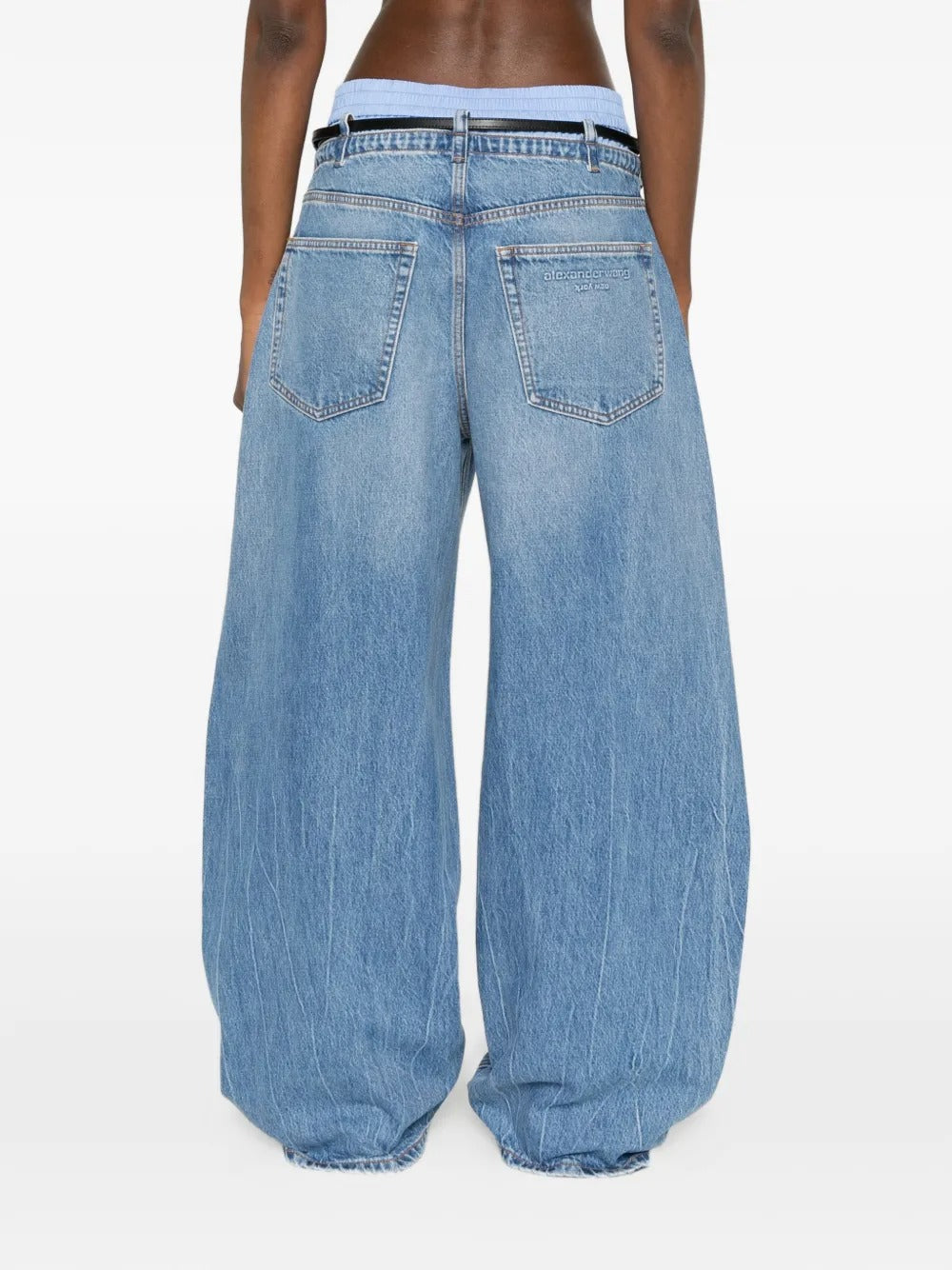 Blue jeans worn by a person, showing the jeans fit
