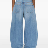 Blue jeans worn by a person, showing the jeans fit