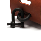 Close up of red bracelet, showing texture of the leather fabric