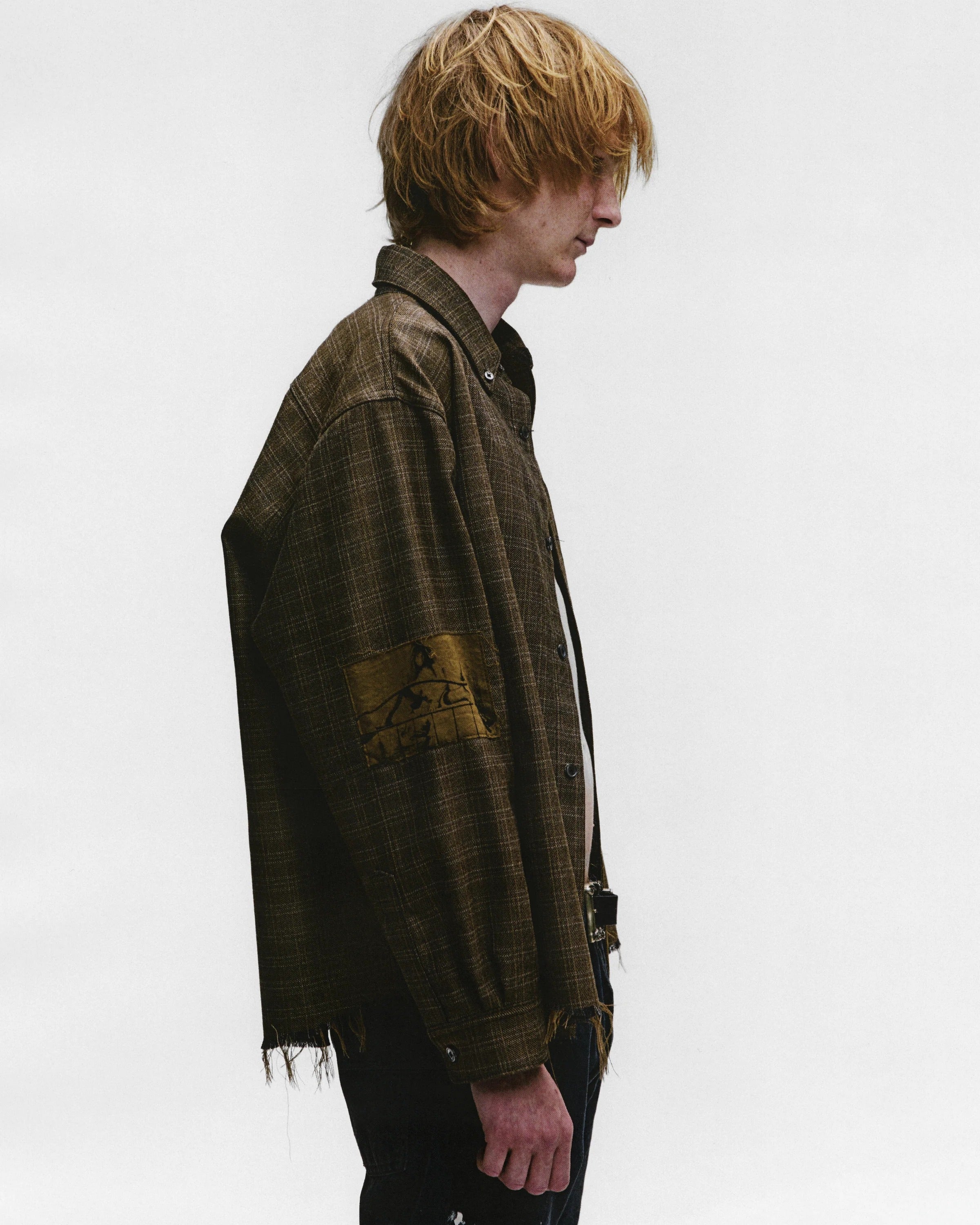 Brown shirts worn by a person, showing the shirts fit