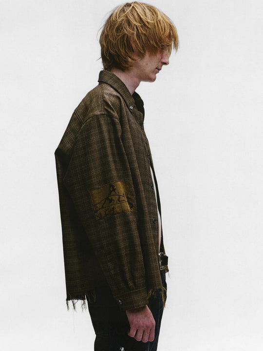 Brown shirts worn by a person, showing the shirts fit