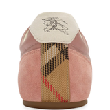 Close up of the pink sneakers, showing  texture of the lambskin