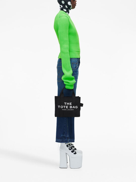 Black bag worn by a person, showing the bag's fit