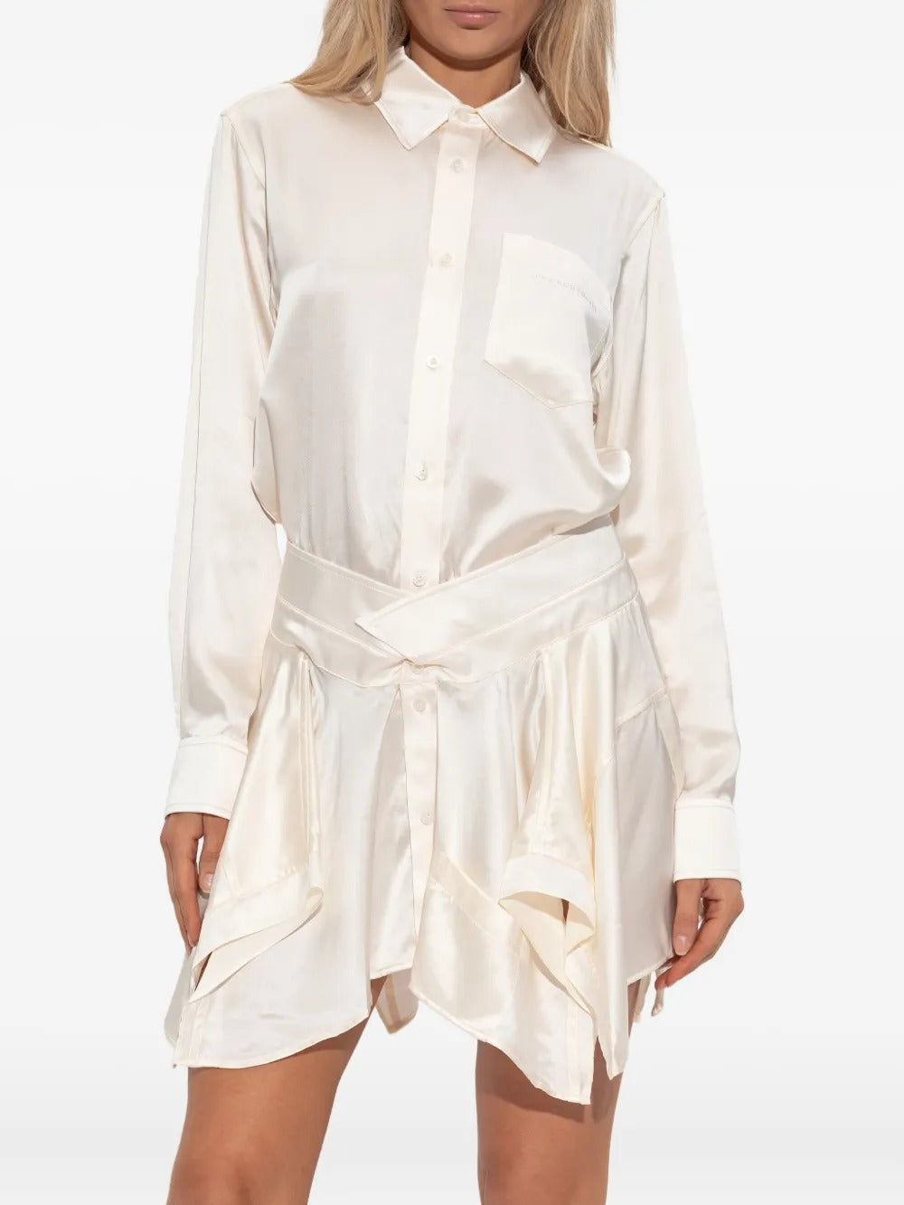 White dress worn by a person, showing the dress's fit