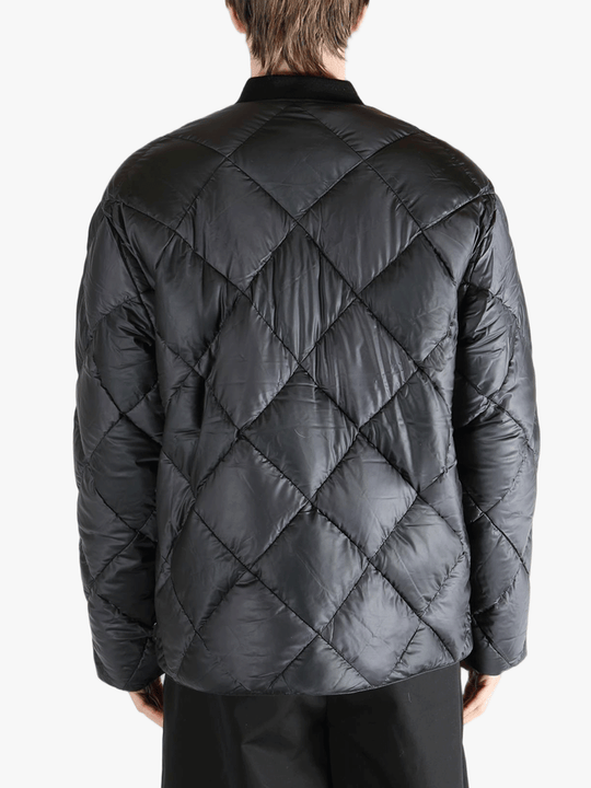 Black jackets-coats worn by a person, showing the fit