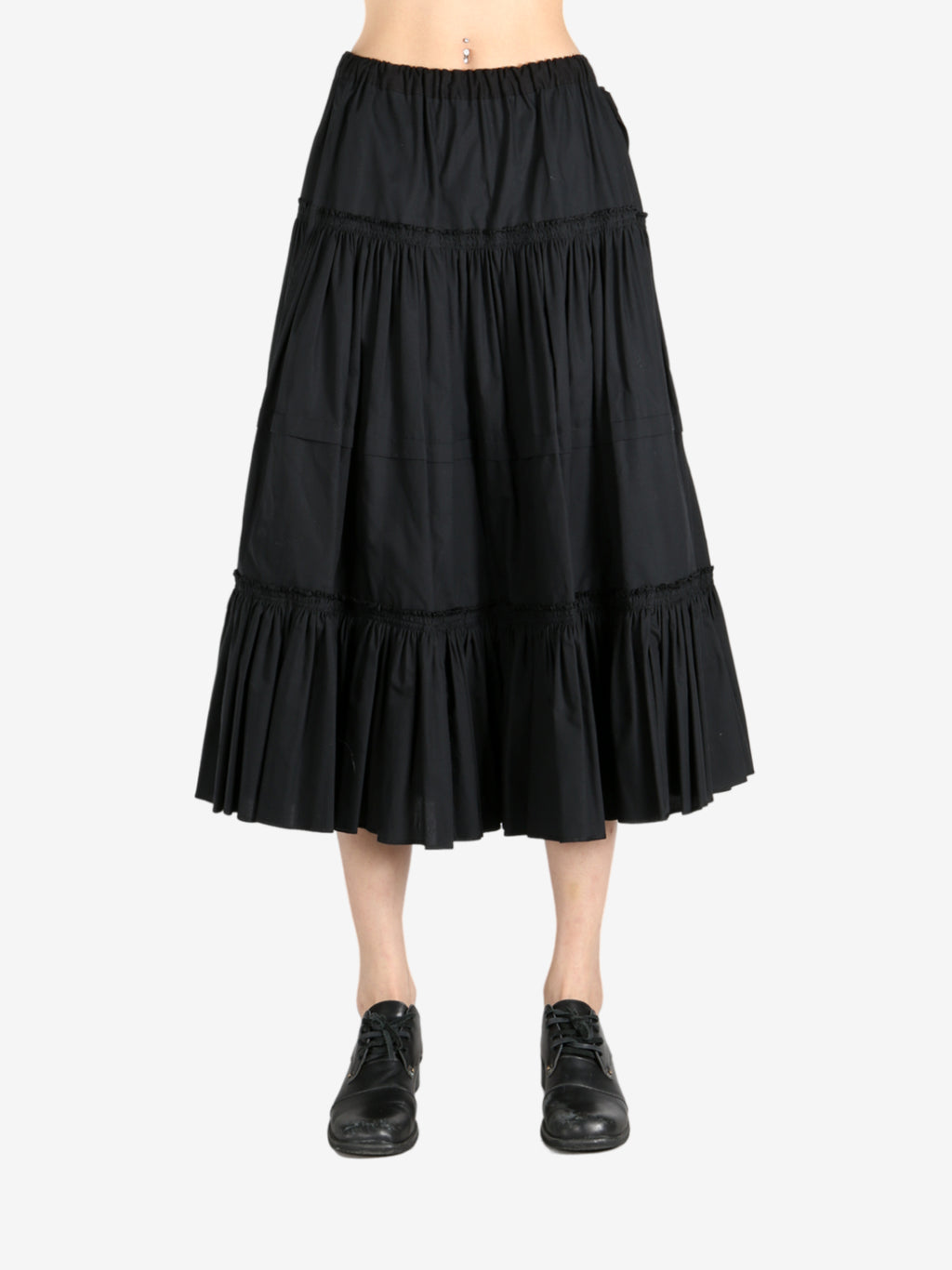 Black dresses worn by a person, showing the dresses  fit