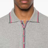 Close up of the grey shirt, showing texture of the cotton fabric