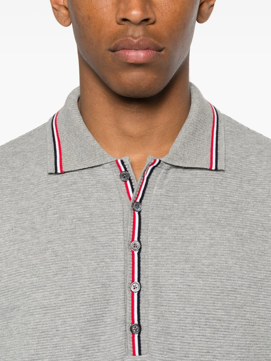 Close up of the grey shirt, showing texture of the cotton fabric