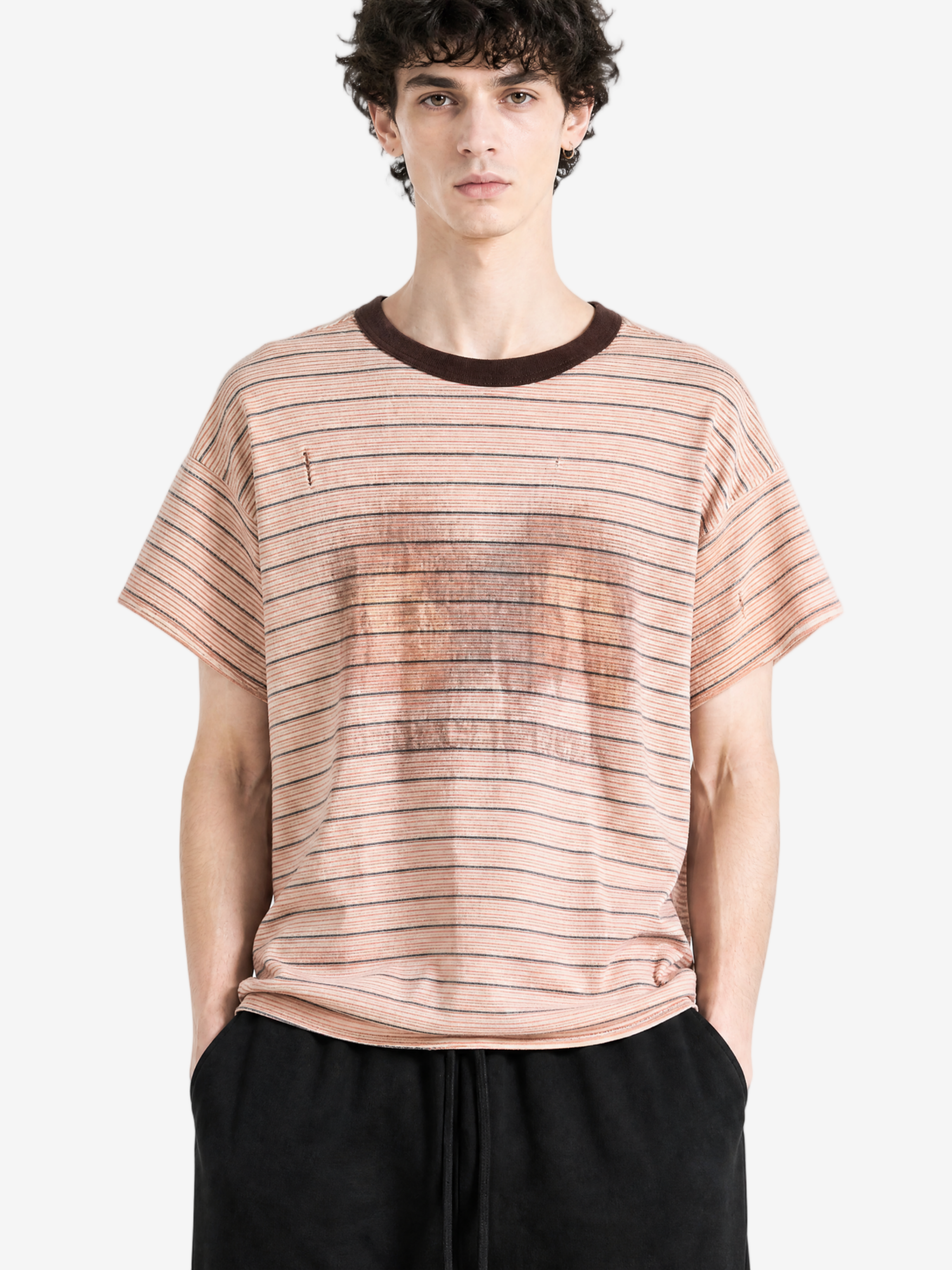 Pink t-shirt worn by a person, showing the t-shirt fit