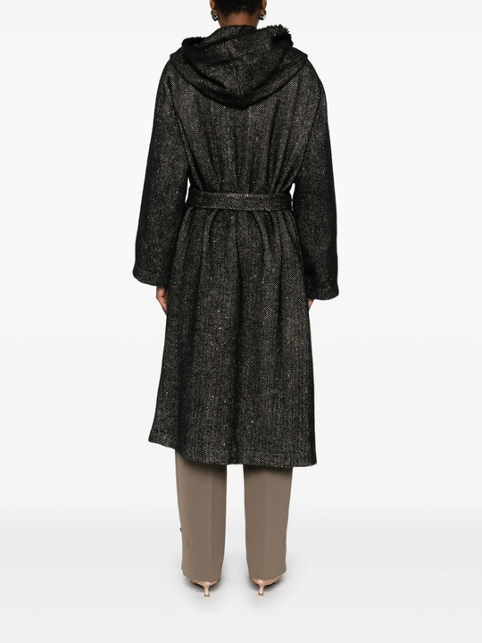 Black coat  worn by a person, showing the coat's fit