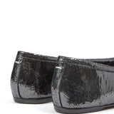 Close up of black flats, showing texture of the leather fabric