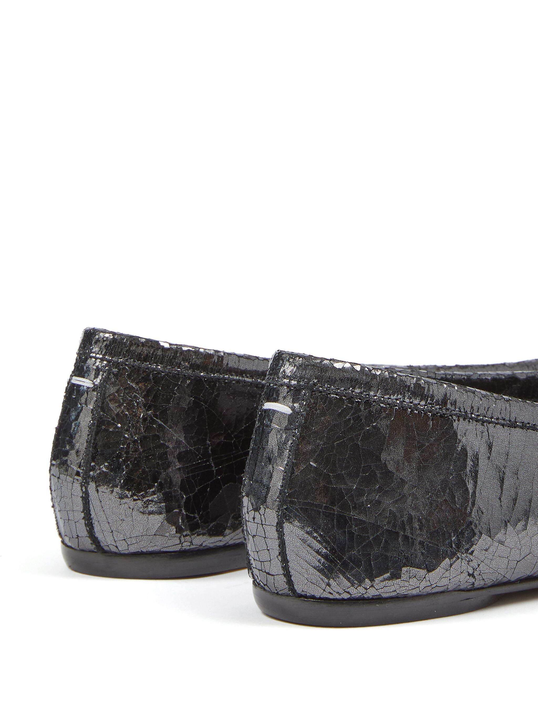 Close up of black flats, showing texture of the leather fabric