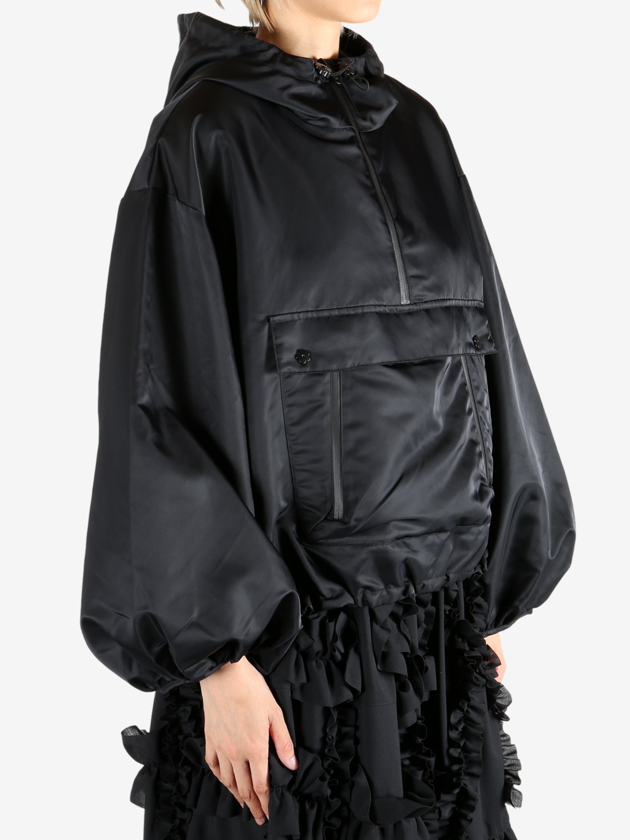 Black jacket worn by a person, showing the jacket's fit