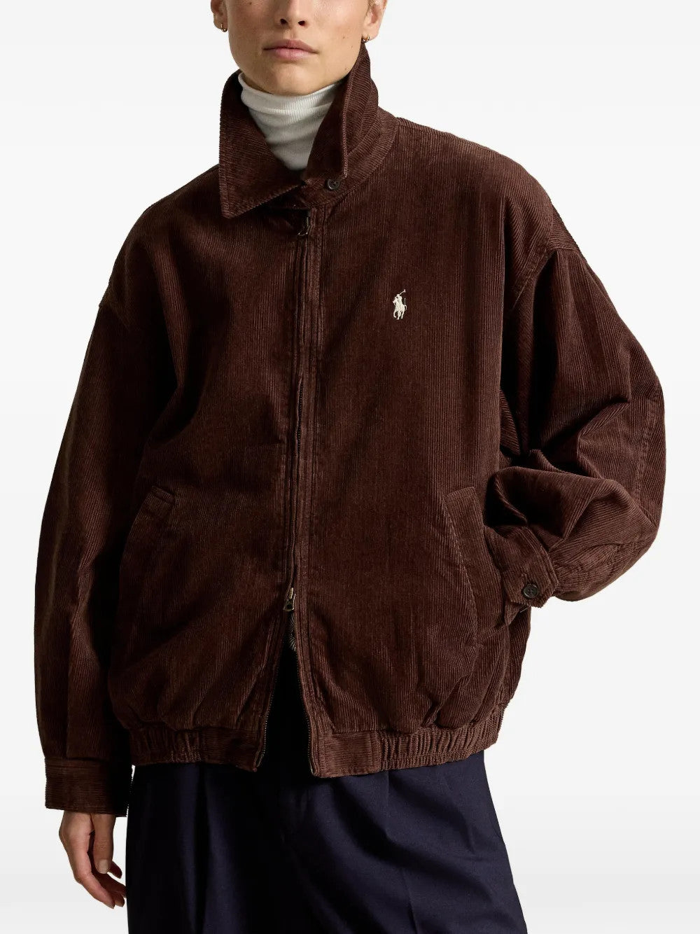 Brown jacket worn by a person, showing the jacket fit
