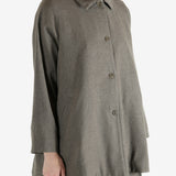 Grey coat worn by a person, showing the coat fit