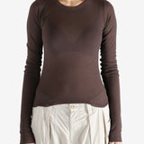 Brown t-shirt worn by a person, showing the t-shirt's fit