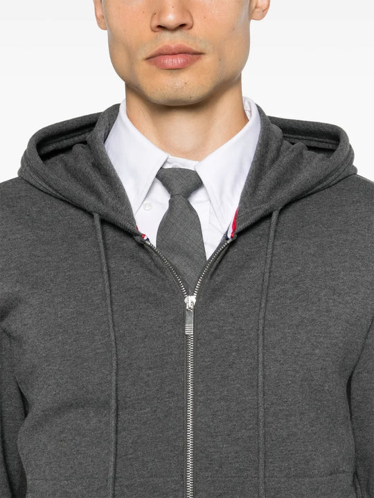 Close up of grey hoodie, showing texture of the cotton fabric