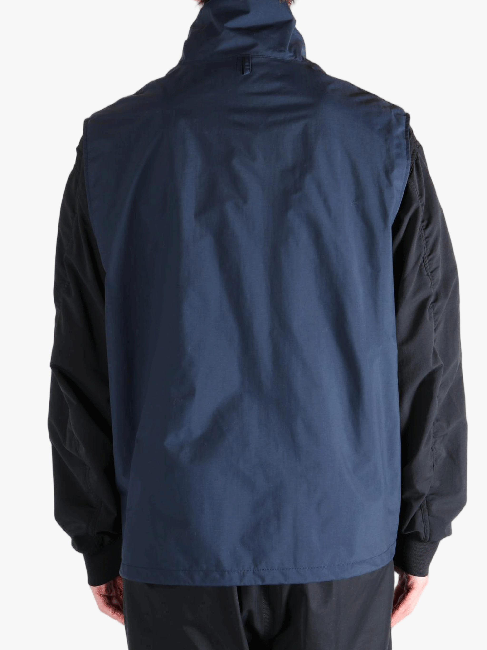 Blue tops worn by a person, showing the tops fit