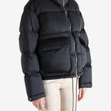 Black jacket worn by a person, showing the jacket fit