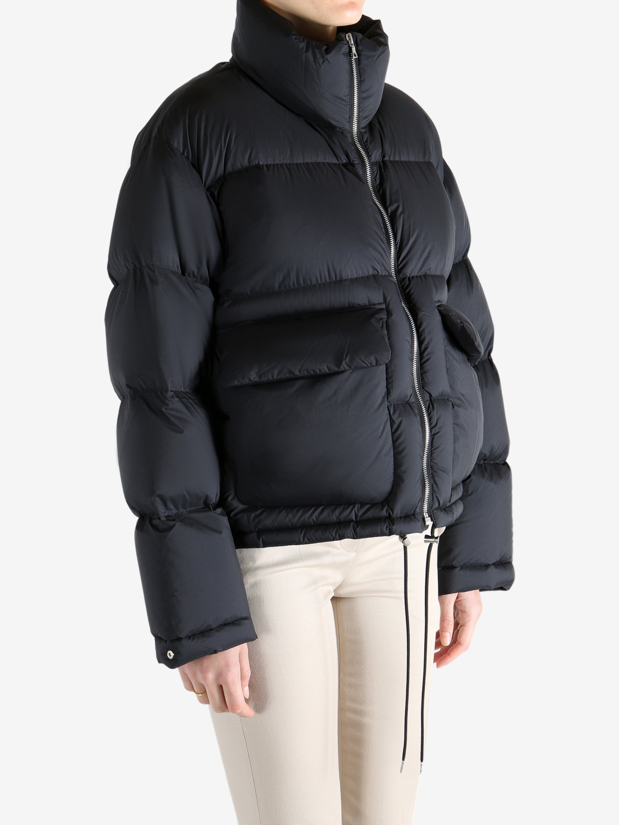 Black jacket worn by a person, showing the jacket fit