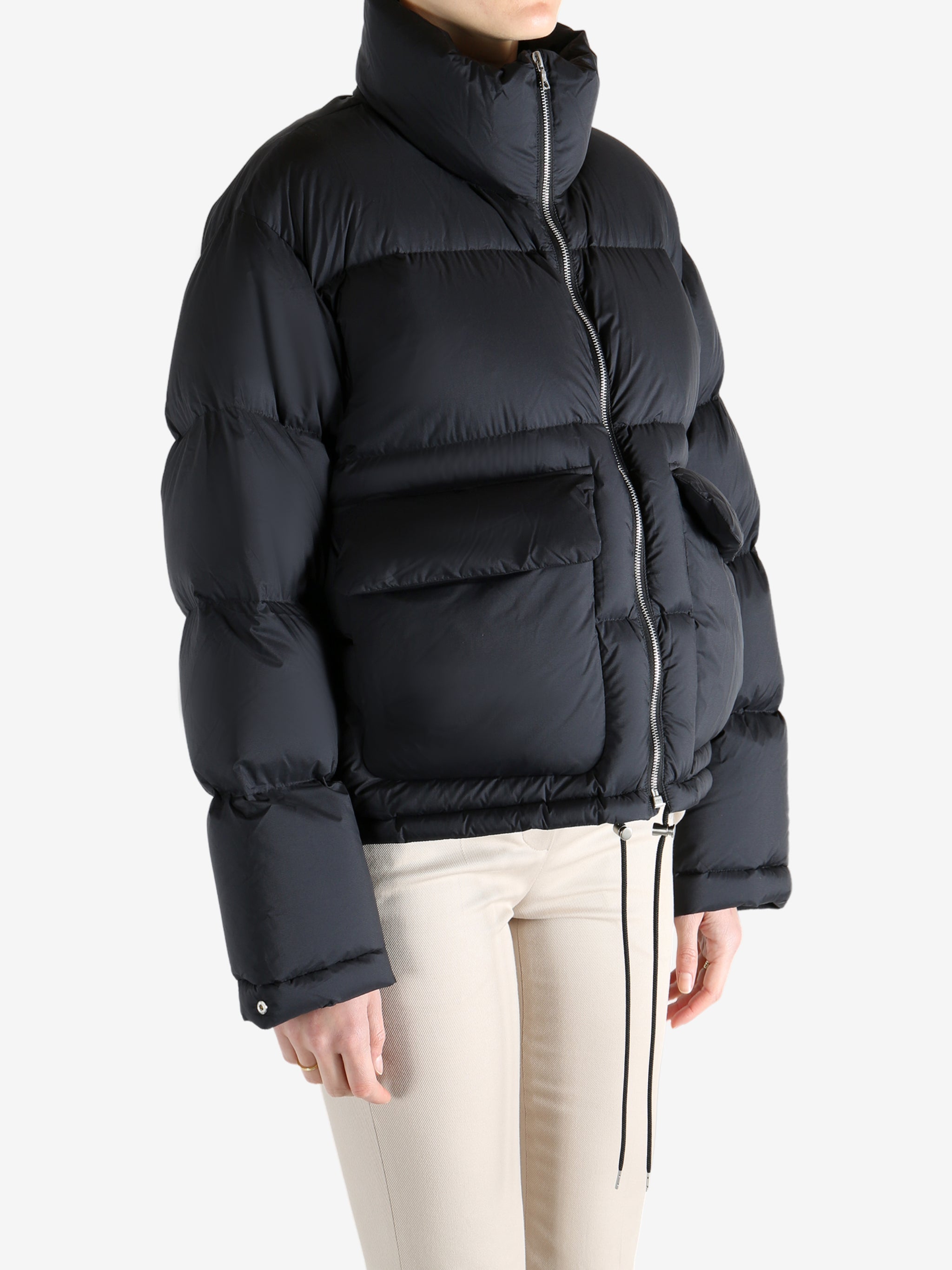 Black jacket worn by a person, showing the jacket fit