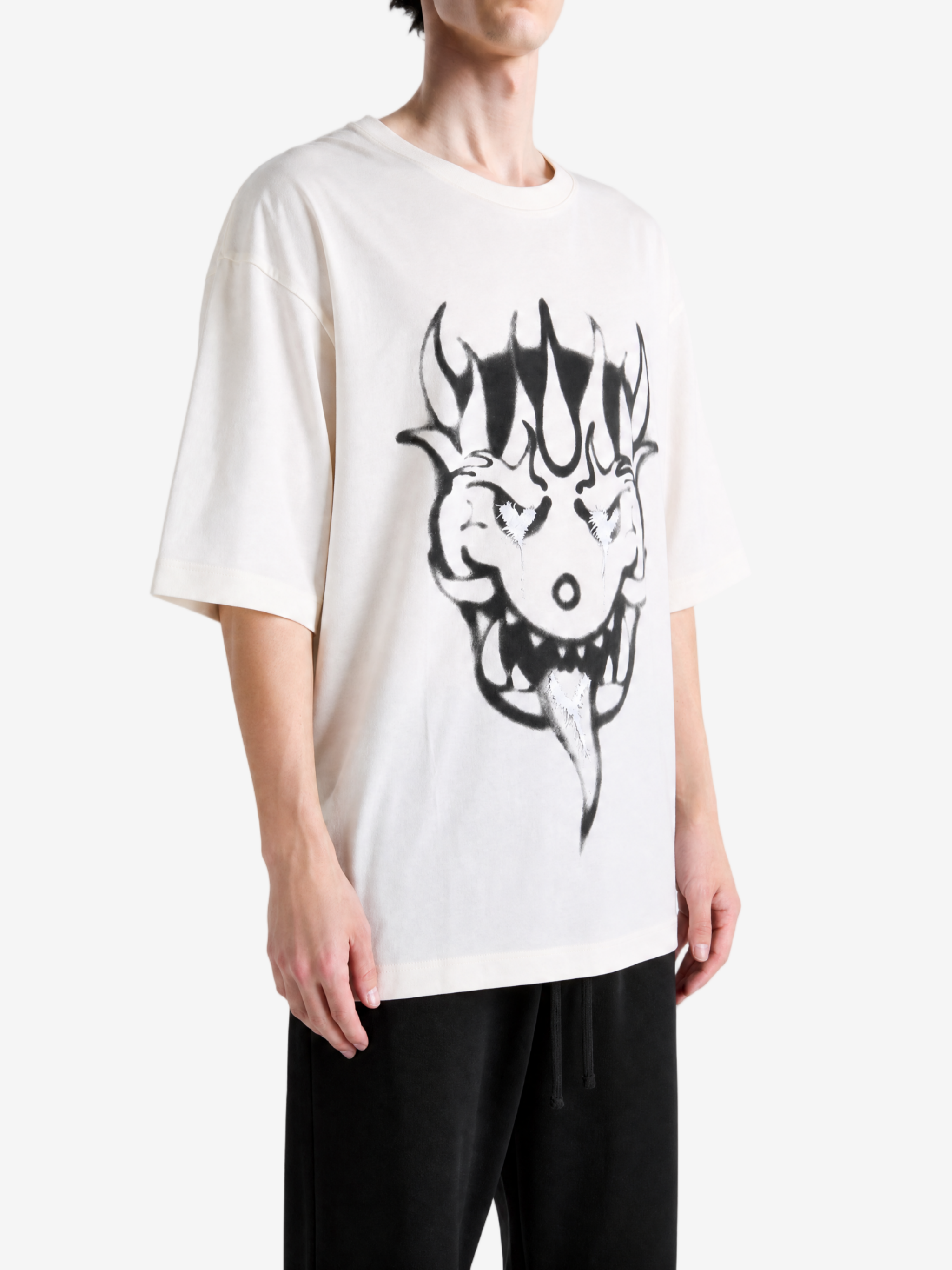Tan t-shirt worn by a person, showing the t-shirt fit