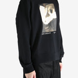 Black hoodies worn by a person, showing the hoodies fit