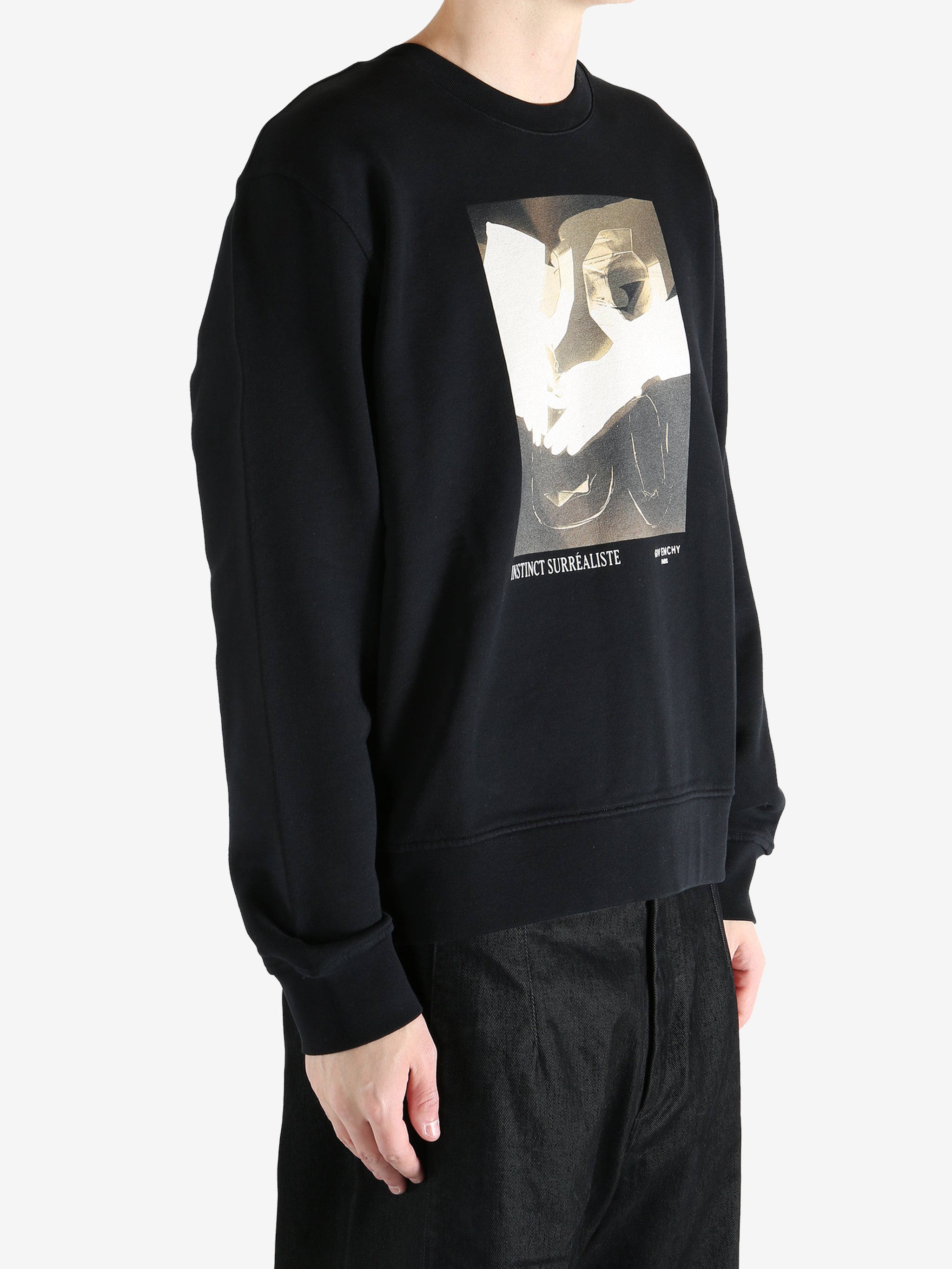 Black hoodies worn by a person, showing the hoodies fit