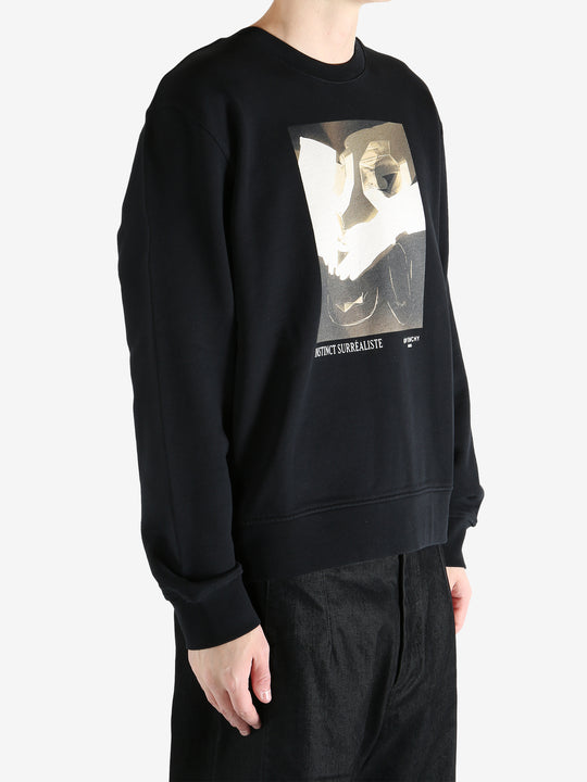 Black hoodies worn by a person, showing the hoodies fit