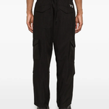 Black pant worn by a person, showing the pant's fit