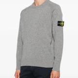 Grey sweats worn by a person, showing the sweats' fit