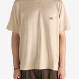 Tan t-shirt worn by a person, showing the t-shirt's fit